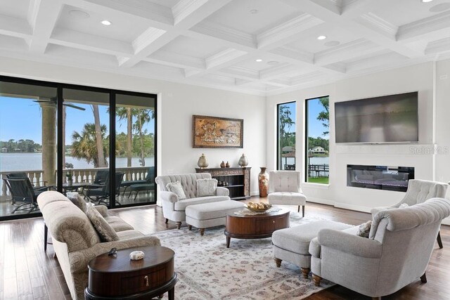 17124 Crawley Rd, Odessa, FL 33556 - living area with recessed lighting, wood finished floors, beamed ceiling, coffered ceiling, and a glass covered fireplace