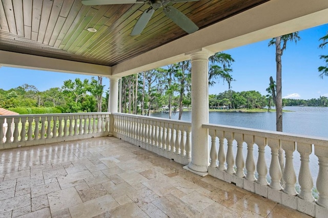 17124 Crawley Rd, Odessa, FL 33556 - view of patio with a ceiling fan, a water view, a balcony, and view of scattered trees