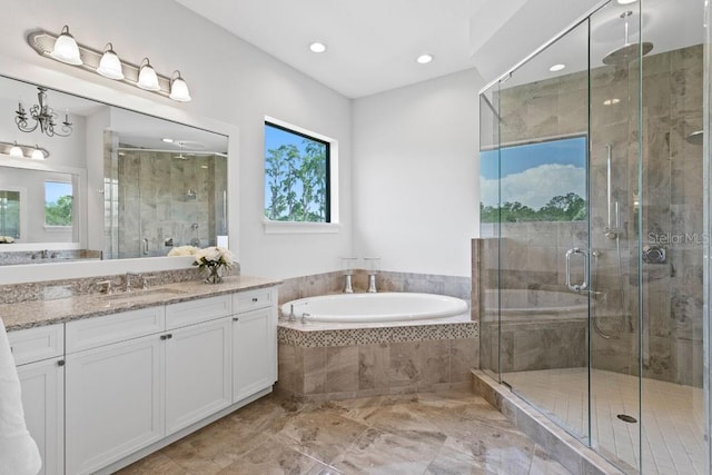 17124 Crawley Rd, Odessa, FL 33556 - full bath featuring vanity, a bath, a shower stall, recessed lighting, and marble finish floors