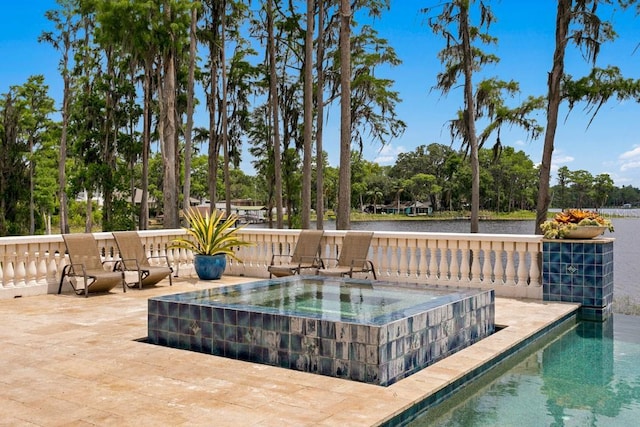 17124 Crawley Rd, Odessa, FL 33556 - view of pool with an in-ground hot tub, a water view, and view of wooded area