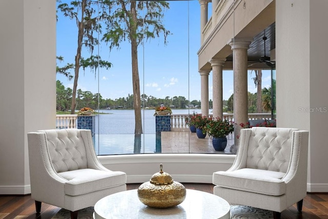 17124 Crawley Rd, Odessa, FL 33556 - living area with ceiling fan, a water view, baseboards, and wood finished floors