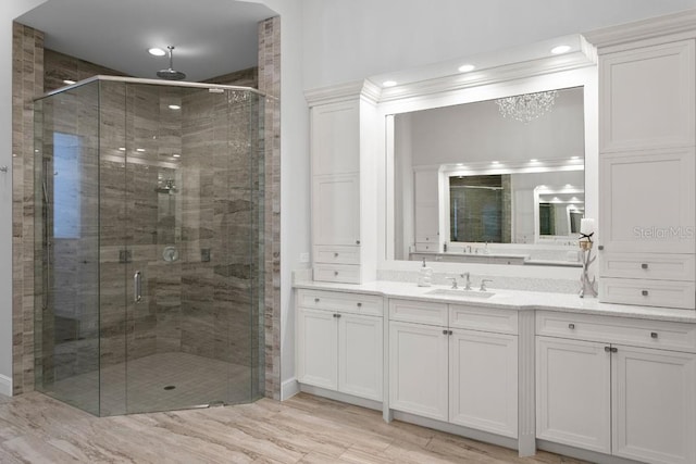 17124 Crawley Rd, Odessa, FL 33556 - bathroom with a shower stall, vanity, wood finished floors, and recessed lighting