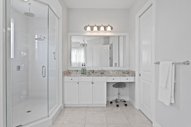 17124 Crawley Rd, Odessa, FL 33556 - bathroom with a shower stall, vanity, baseboards, and a chandelier