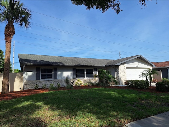 3357 Hunt Club Dr, Clearwater, FL 33761 - ranch-style house featuring an attached garage, stone siding, and a front lawn