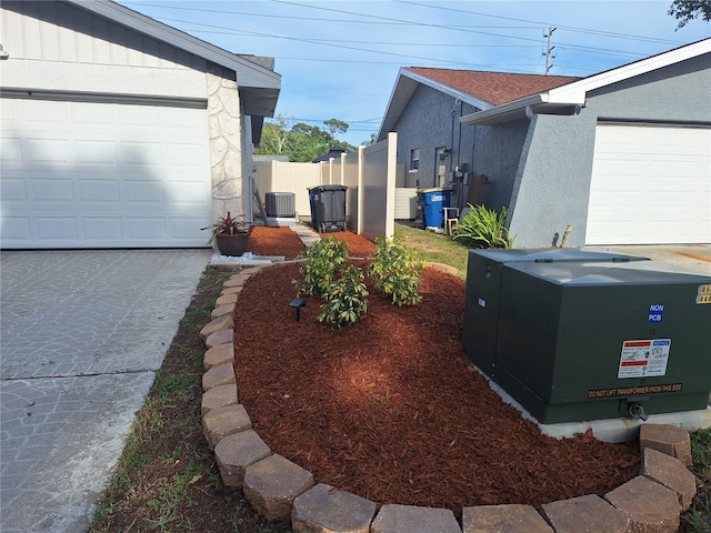 3357 Hunt Club Dr, Clearwater, FL 33761 - view of yard with central AC unit and a garage