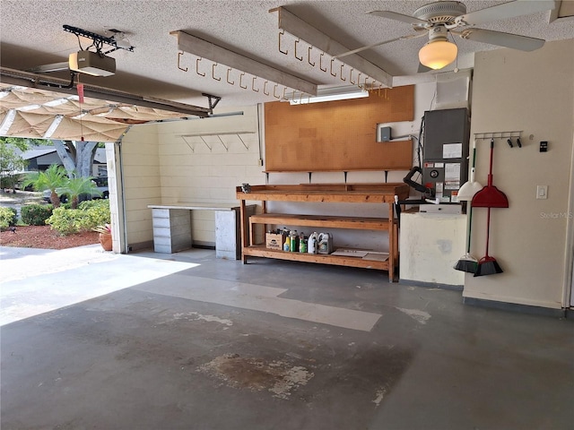 3357 Hunt Club Dr, Clearwater, FL 33761 - garage featuring a workshop area, a garage door opener, heating unit, and ceiling fan