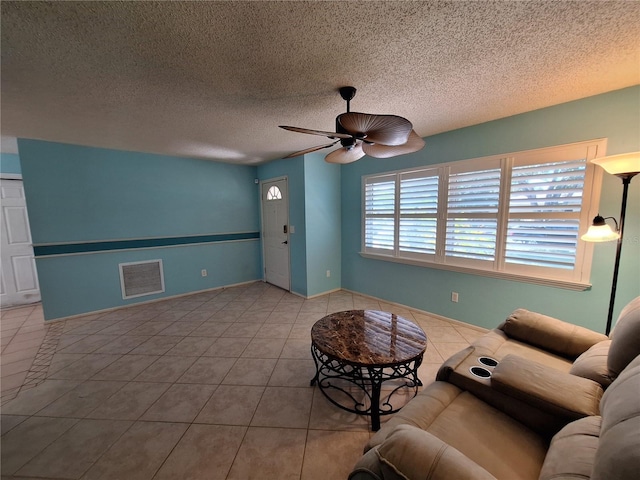 3357 Hunt Club Dr, Clearwater, FL 33761 - tiled living room with a ceiling fan and a textured ceiling
