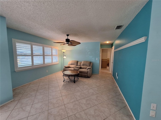 3357 Hunt Club Dr, Clearwater, FL 33761 - living area with ceiling fan, light tile patterned floors, and a textured ceiling