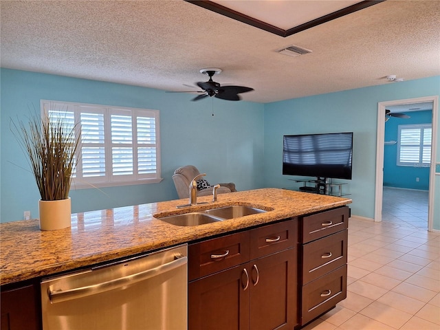 3357 Hunt Club Dr, Clearwater, FL 33761 - kitchen with stainless steel dishwasher, a sink, ceiling fan, light tile patterned flooring, and light stone countertops