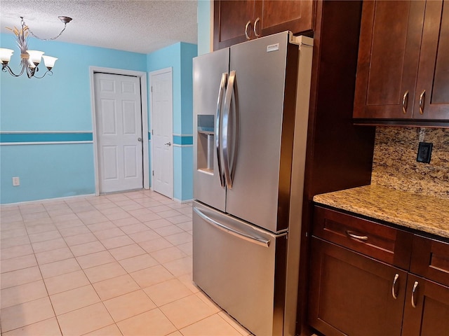 3357 Hunt Club Dr, Clearwater, FL 33761 - kitchen featuring stainless steel refrigerator with ice dispenser, a chandelier, backsplash, a textured ceiling, and light tile patterned floors