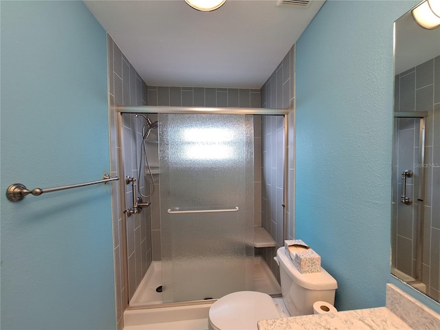 3357 Hunt Club Dr, Clearwater, FL 33761 - full bath with toilet, a stall shower, vanity, and a textured wall