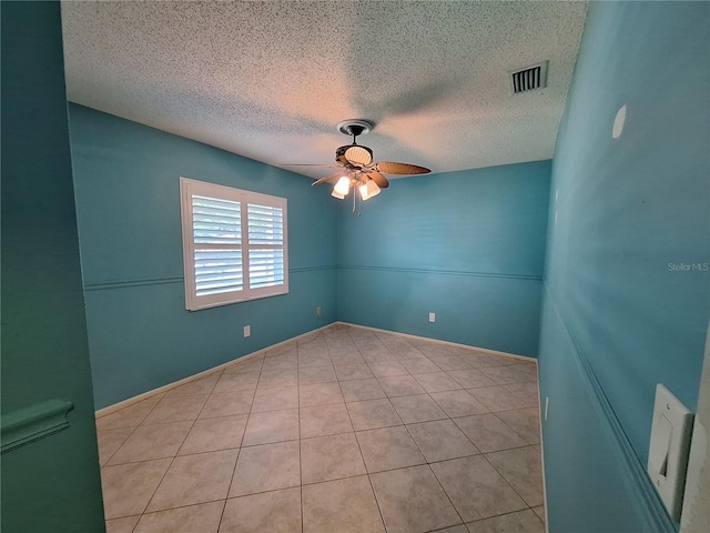 3357 Hunt Club Dr, Clearwater, FL 33761 - unfurnished room featuring a ceiling fan, tile patterned floors, and a textured ceiling