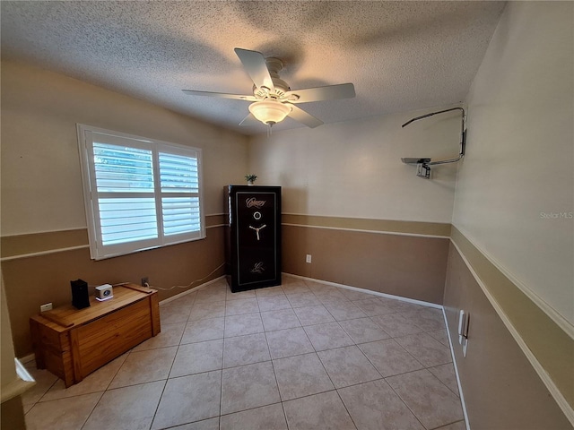 3357 Hunt Club Dr, Clearwater, FL 33761 - bedroom featuring a textured ceiling, a ceiling fan, and light tile patterned floors