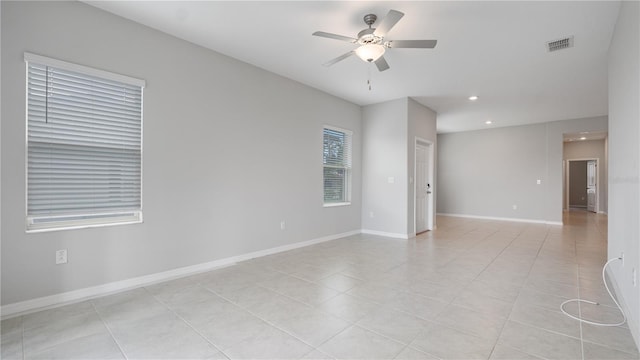 spare room with ceiling fan, recessed lighting, light tile patterned floors, and baseboards
