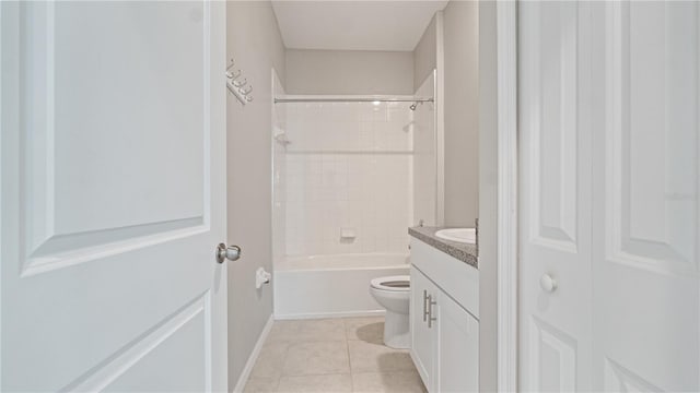 full bathroom featuring toilet, vanity, tile patterned floors, baseboards, and washtub / shower combination
