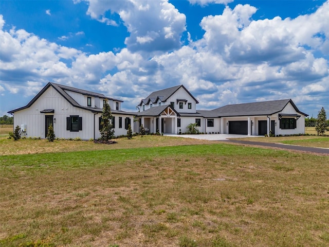 3515 Powerline Rd, Lithia, FL 33547 - modern farmhouse with an attached garage, driveway, a front lawn, and board and batten siding