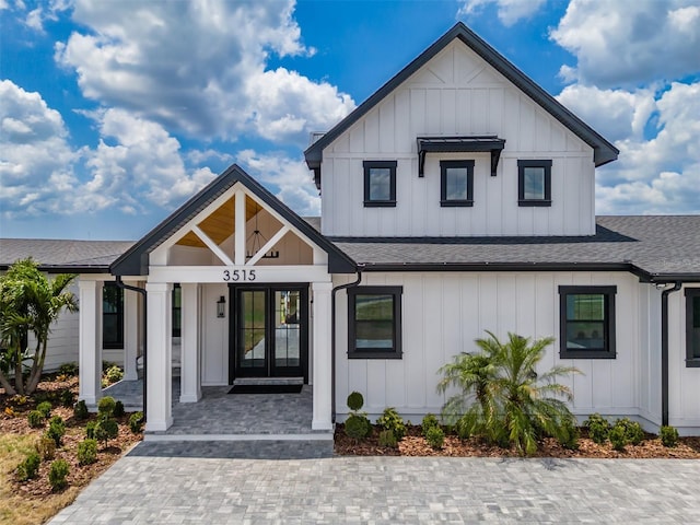 3515 Powerline Rd, Lithia, FL 33547 - modern farmhouse style home featuring board and batten siding, a shingled roof, and covered porch