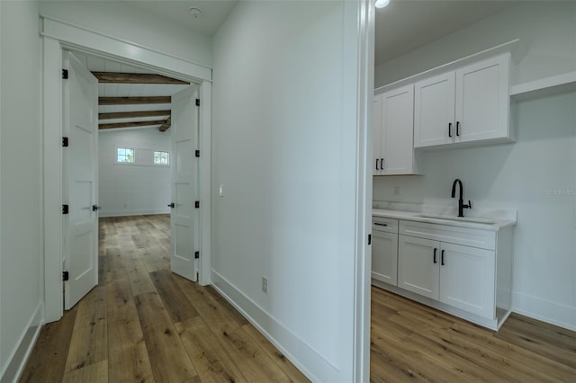 3515 Powerline Rd, Lithia, FL 33547 - hall with light wood-style flooring, a sink, and baseboards