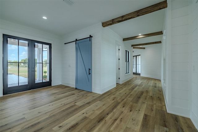 3515 Powerline Rd, Lithia, FL 33547 - empty room featuring french doors, wood-type flooring, a barn door, beam ceiling, and recessed lighting