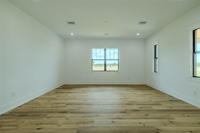 3515 Powerline Rd, Lithia, FL 33547 - spare room with healthy amount of natural light, recessed lighting, light wood-style floors, and baseboards