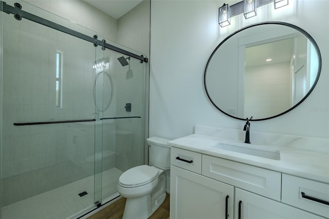 3515 Powerline Rd, Lithia, FL 33547 - bathroom with toilet, wood finished floors, a stall shower, and vanity