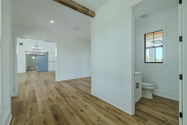 3515 Powerline Rd, Lithia, FL 33547 - corridor with light wood finished floors, a chandelier, beamed ceiling, and recessed lighting