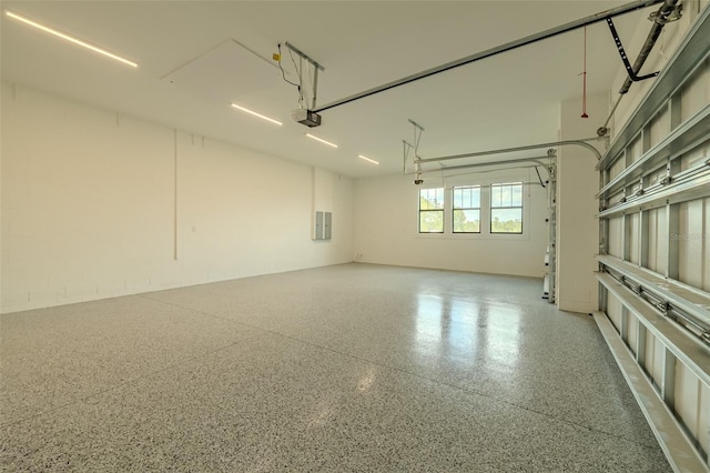 3515 Powerline Rd, Lithia, FL 33547 - garage featuring a garage door opener and electric panel
