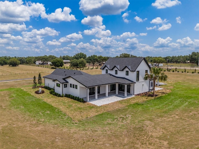 3515 Powerline Rd, Lithia, FL 33547 - back of house with a patio area, a yard, and a rural view