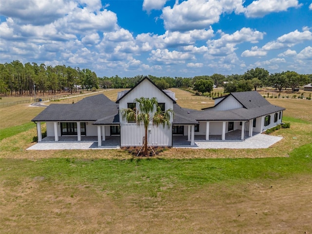 3515 Powerline Rd, Lithia, FL 33547 - back of property featuring a porch, a lawn, and roof with shingles