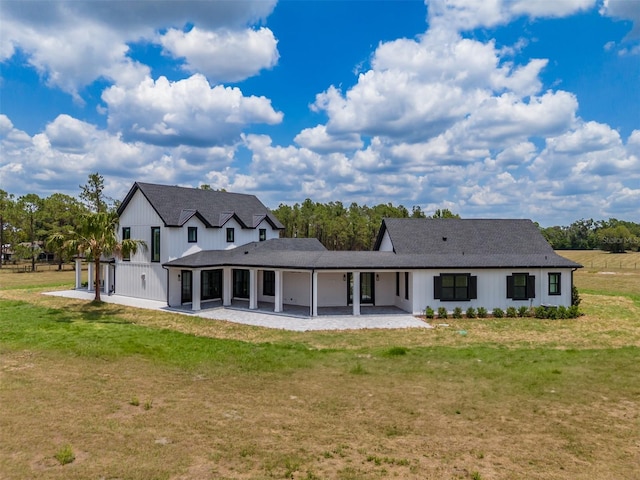 3515 Powerline Rd, Lithia, FL 33547 - back of house featuring a patio and a lawn