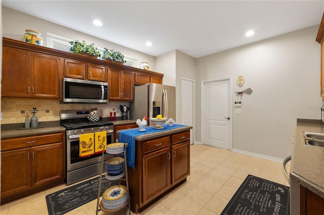 20039 Heritage Point Dr, Tampa, FL 33647 - kitchen with stainless steel appliances, backsplash, dark countertops, and recessed lighting