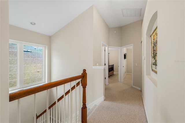 20039 Heritage Point Dr, Tampa, FL 33647 - hallway featuring an upstairs landing, light colored carpet, and baseboards