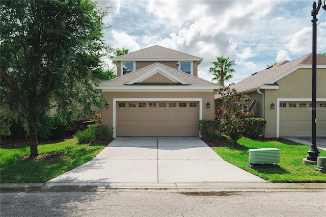 20039 Heritage Point Dr, Tampa, FL 33647 - traditional-style house with stucco siding, concrete driveway, and a garage