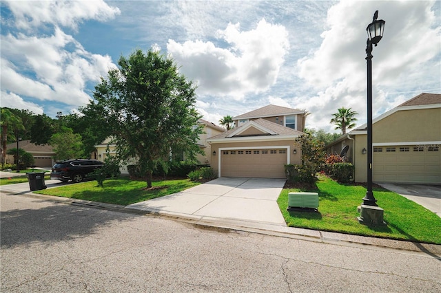 20039 Heritage Point Dr, Tampa, FL 33647 - view of front of home with driveway, a front lawn, and stucco siding