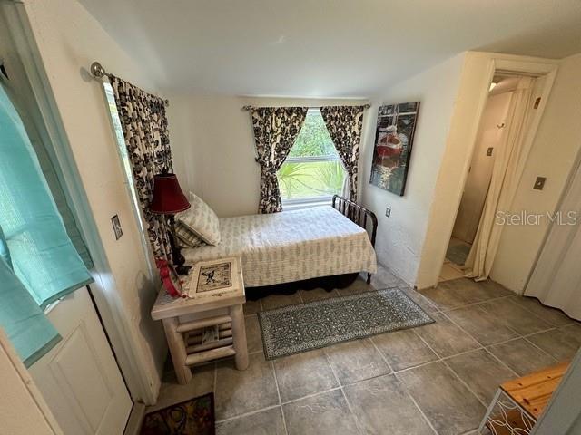 10170 W Yulee Dr, Homosassa, FL 34448 - bedroom featuring tile patterned floors