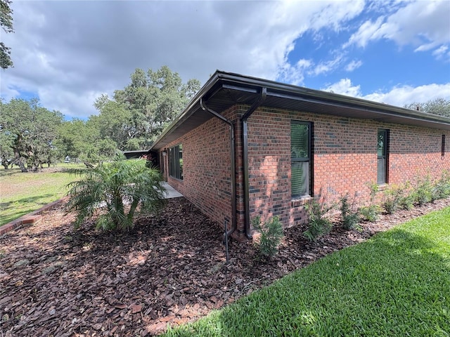6533 Brentwood Dr, Zephyrhills, FL 33542 - view of side of property with brick siding