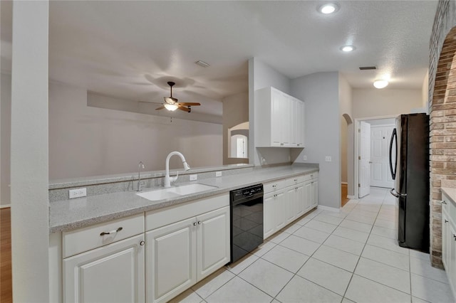6801 Bishops Pointe Way, Riverview, FL 33578 - kitchen with black appliances, a ceiling fan, white cabinets, light tile patterned floors, and light stone countertops