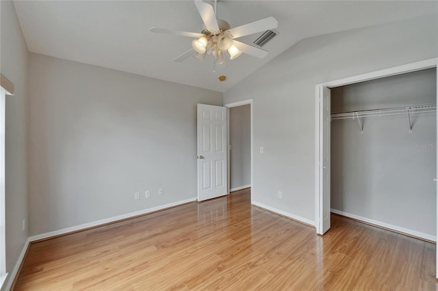 6801 Bishops Pointe Way, Riverview, FL 33578 - unfurnished bedroom featuring vaulted ceiling, a closet, light wood-style floors, and ceiling fan