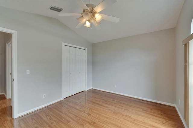 6801 Bishops Pointe Way, Riverview, FL 33578 - unfurnished bedroom with vaulted ceiling, light wood-style flooring, a closet, and a ceiling fan