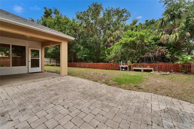 6801 Bishops Pointe Way, Riverview, FL 33578 - fenced backyard featuring a patio and view of scattered trees