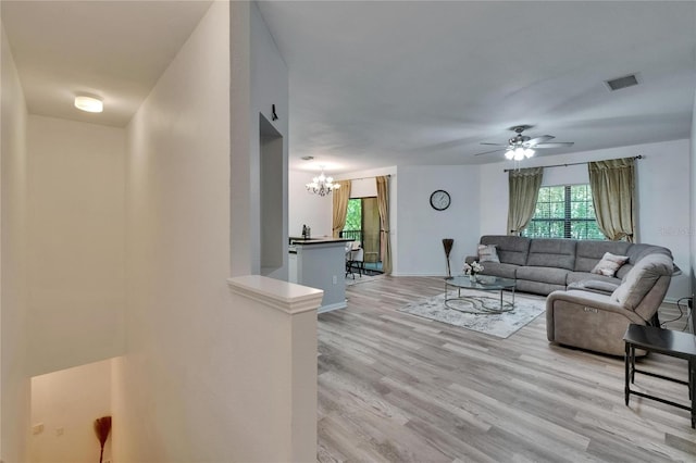2220 Chianti Pl Unit 8-0828, Palm Harbor, FL 34683 - living room with a chandelier, plenty of natural light, light wood-type flooring, and ceiling fan