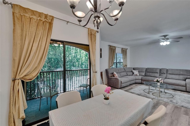2220 Chianti Pl Unit 8-0828, Palm Harbor, FL 34683 - dining room featuring a chandelier, wood finished floors, and a ceiling fan