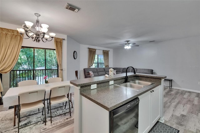 2220 Chianti Pl Unit 8-0828, Palm Harbor, FL 34683 - kitchen with a sink, dishwasher, a chandelier, white cabinetry, and light wood-type flooring