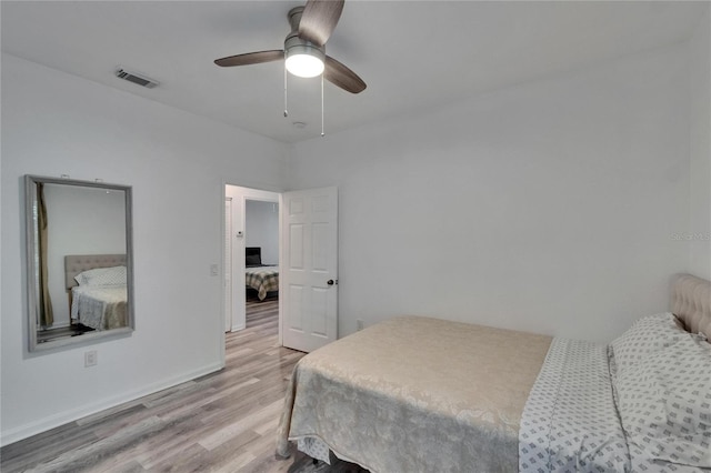2220 Chianti Pl Unit 8-0828, Palm Harbor, FL 34683 - bedroom with light wood finished floors, baseboards, and a ceiling fan