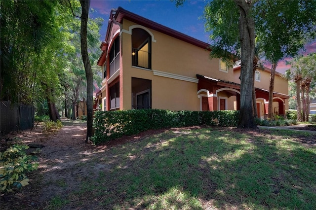 2220 Chianti Pl Unit 8-0828, Palm Harbor, FL 34683 - view of side of property featuring stucco siding