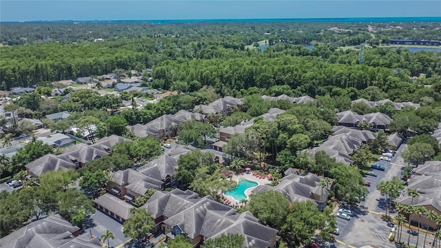 2220 Chianti Pl Unit 8-0828, Palm Harbor, FL 34683 - aerial view of residential area featuring a heavily wooded area and a pool