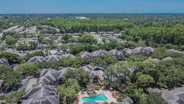 2220 Chianti Pl Unit 8-0828, Palm Harbor, FL 34683 - aerial view of residential area featuring a pool area and a heavily wooded area