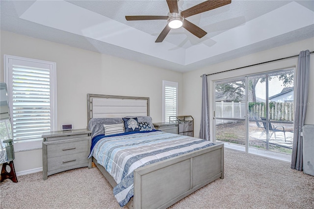 2020 Elk Spring Dr, Brandon, FL 33511 - bedroom featuring a raised ceiling, access to outside, carpet, ceiling fan, and baseboards