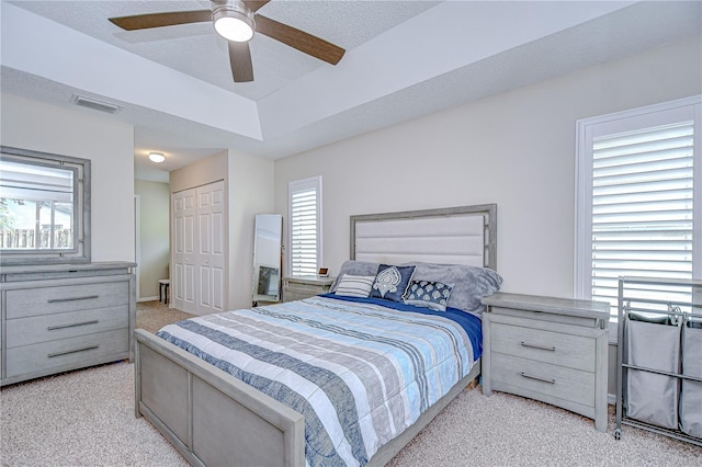 2020 Elk Spring Dr, Brandon, FL 33511 - bedroom with light colored carpet, multiple windows, a closet, and ceiling fan