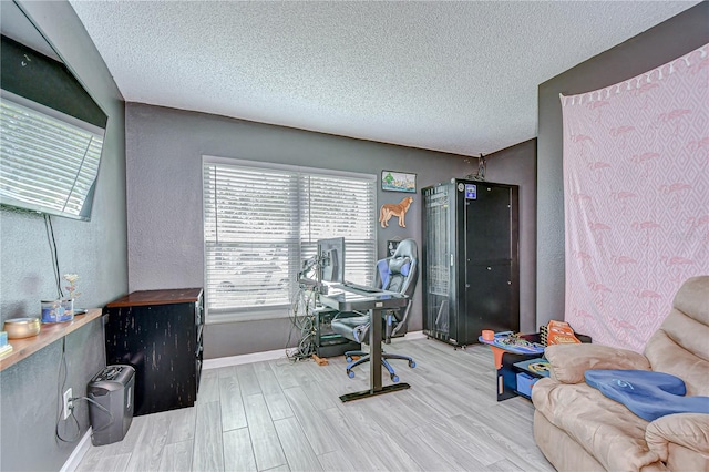 2020 Elk Spring Dr, Brandon, FL 33511 - office area featuring wood finished floors, a textured ceiling, and baseboards